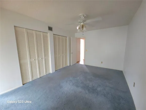a view of a livingroom with a ceiling fan