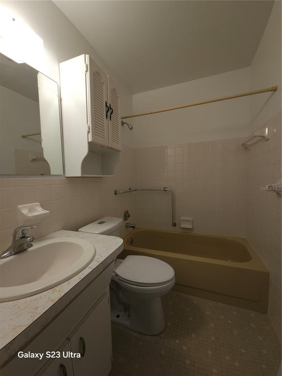 2386 Sumatran Way, Unit 44 Clearwater, FL 33763 - Photo 24 of 25 a bathroom with a sink a toilet and shower
