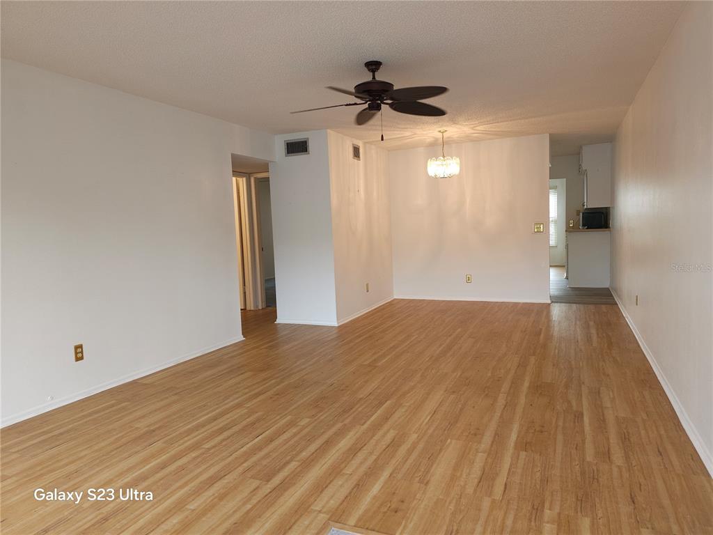 2386 Sumatran Way, Unit 44 Clearwater, FL 33763 - Photo 4 of 25 a view of empty room with wooden floor