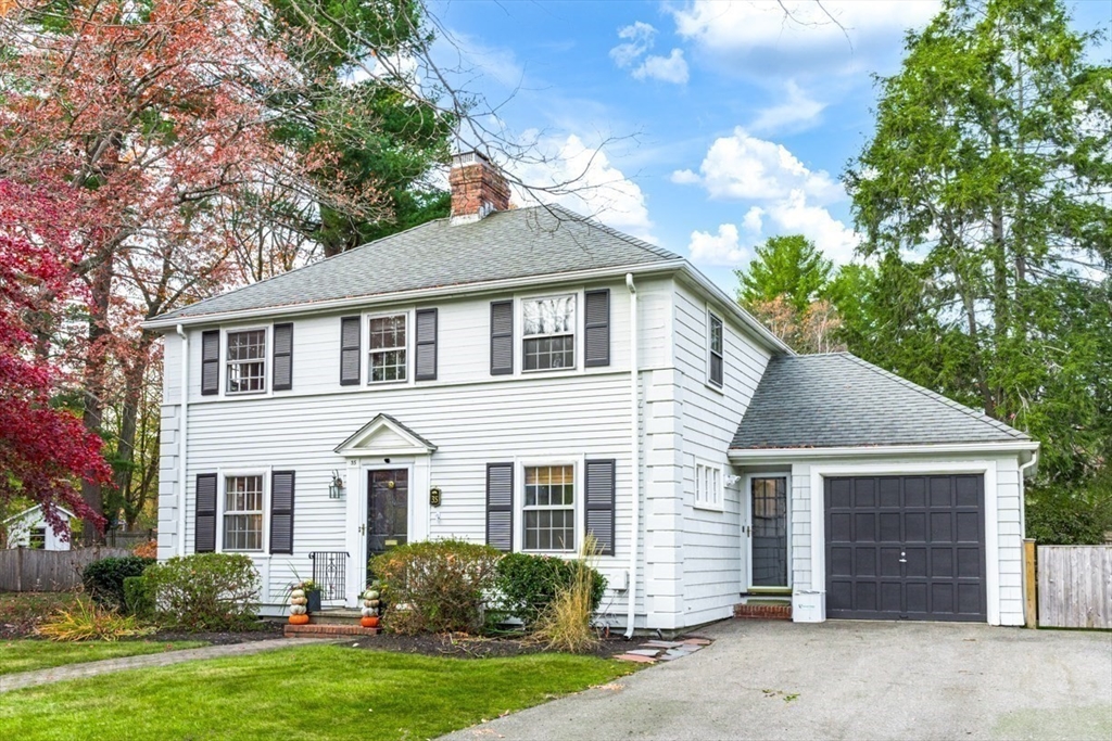 35 Garrison Road Wellesley, MA 02482 - Photo 28 of 28 a front view of a house with a garden and yard