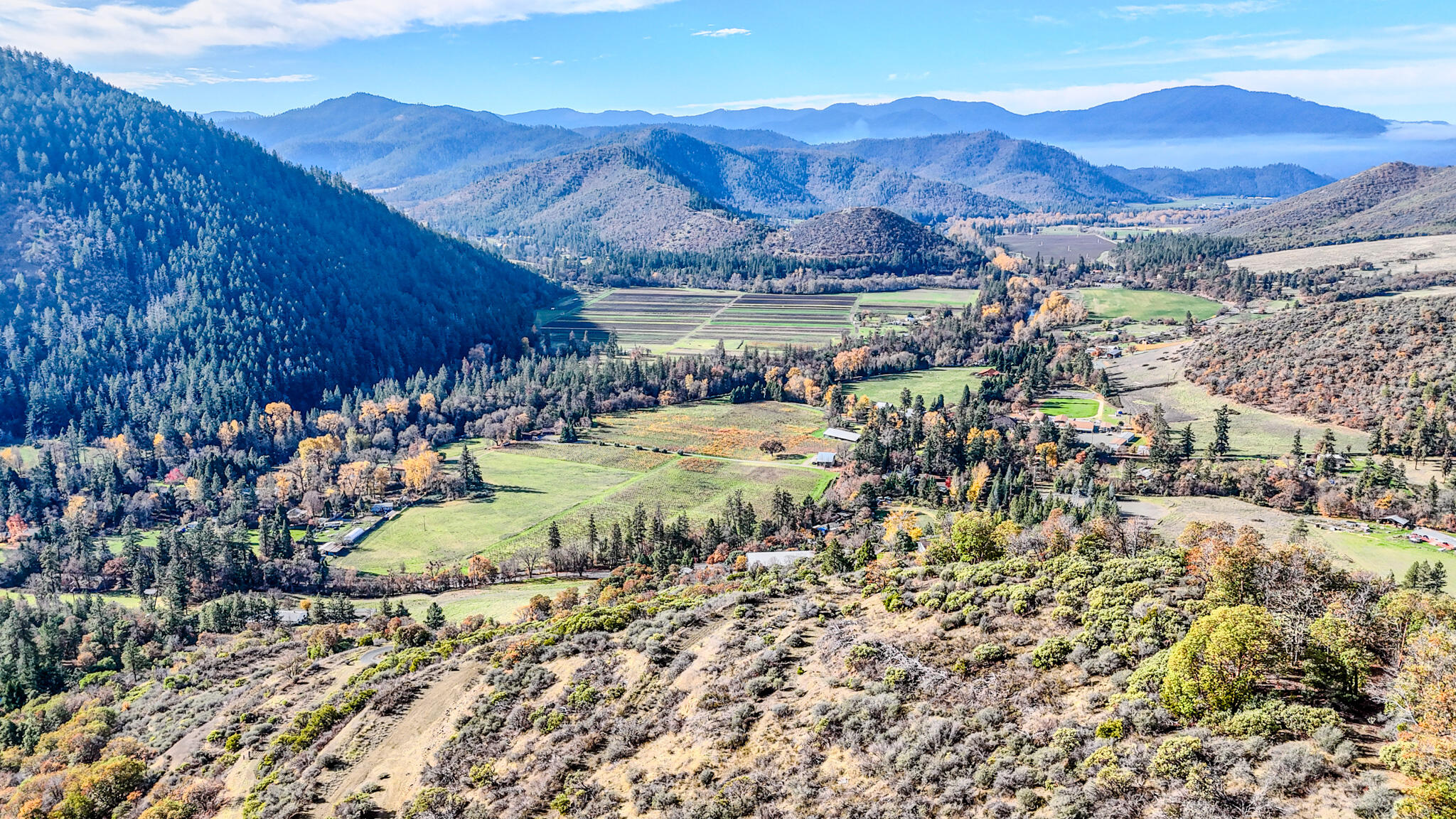 362 Humbug Creek Road Jacksonville, OR 97530 - Photo 24 of 49 a view of a city with mountains in the background