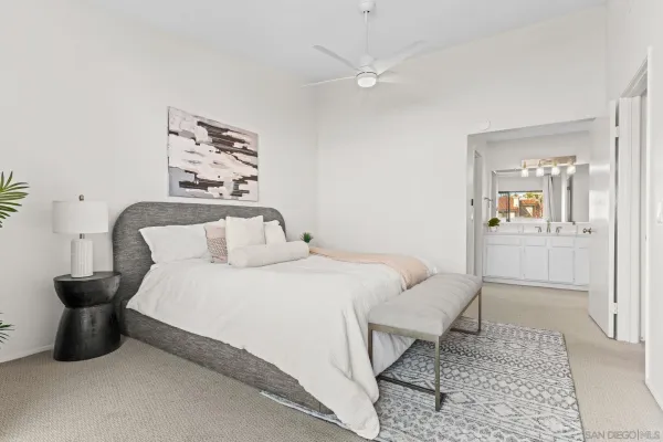 a bedroom with a bed and a mirror