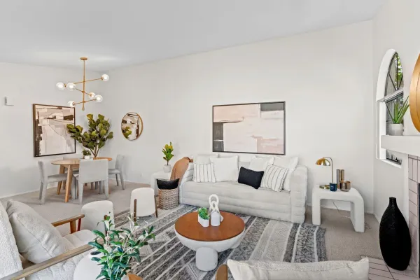 a living room with furniture and a table