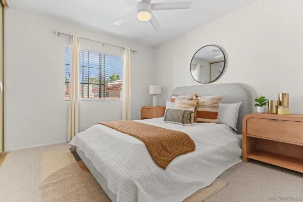 a bedroom with bed and a window