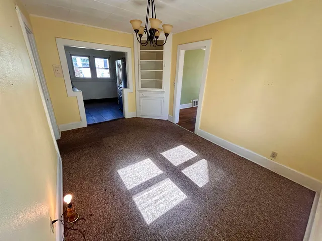 a kitchen with a sink and a refrigerator