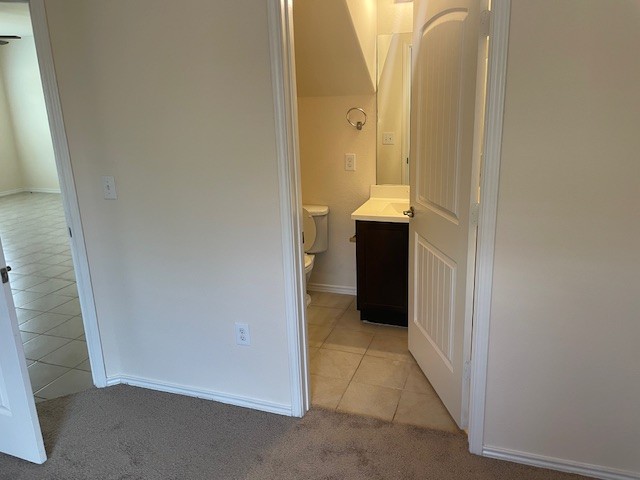 10201 Gertrudis Loop Austin, TX 78747 - Photo 8 of 24 A well-appointed half bath features a vanity and toilet, providing essential convenience.