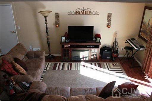 116 Prentice Avenue South River, NJ 08882 - Photo 13 of 27 a living room with furniture and a flat screen tv