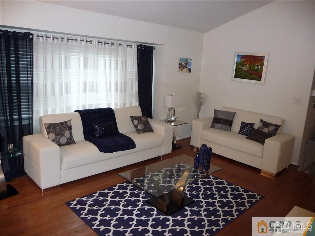 116 Prentice Avenue South River, NJ 08882 - Photo 16 of 27 a living room with furniture and a rug