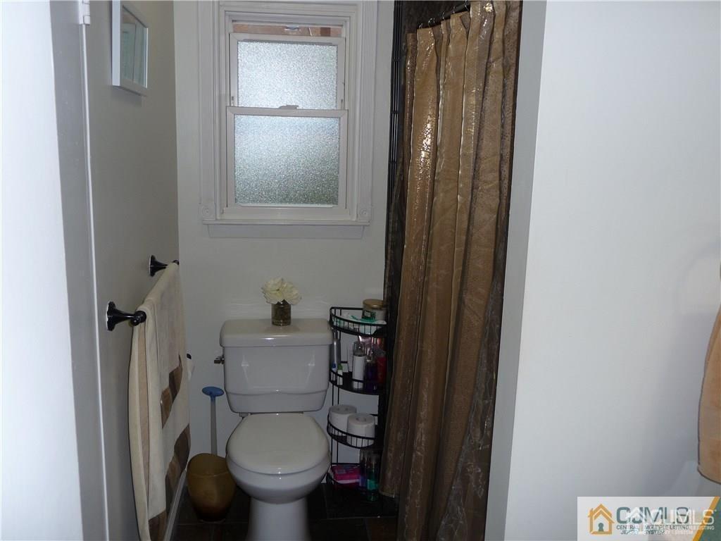 116 Prentice Avenue South River, NJ 08882 - Photo 19 of 27 a white toilet sitting next to a bathroom sink