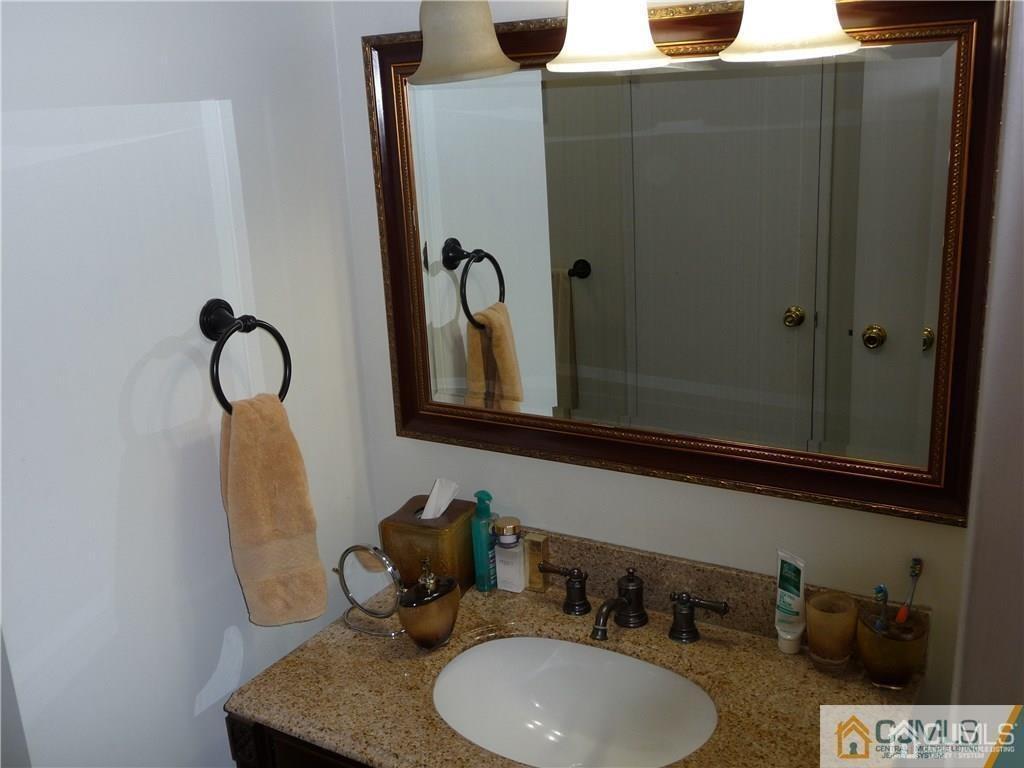 116 Prentice Avenue South River, NJ 08882 - Photo 20 of 27 a bathroom with a sink and mirror
