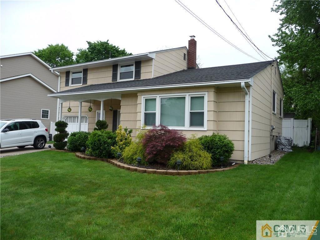 116 Prentice Avenue South River, NJ 08882 - Photo 2 of 27 a front view of a house with a garden