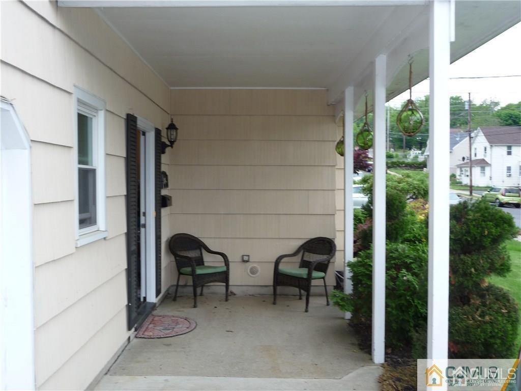 116 Prentice Avenue South River, NJ 08882 - Photo 4 of 27 a view of a porch with chairs and a yard