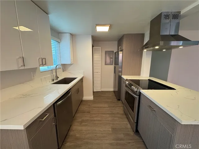 a kitchen with a stove and a sink