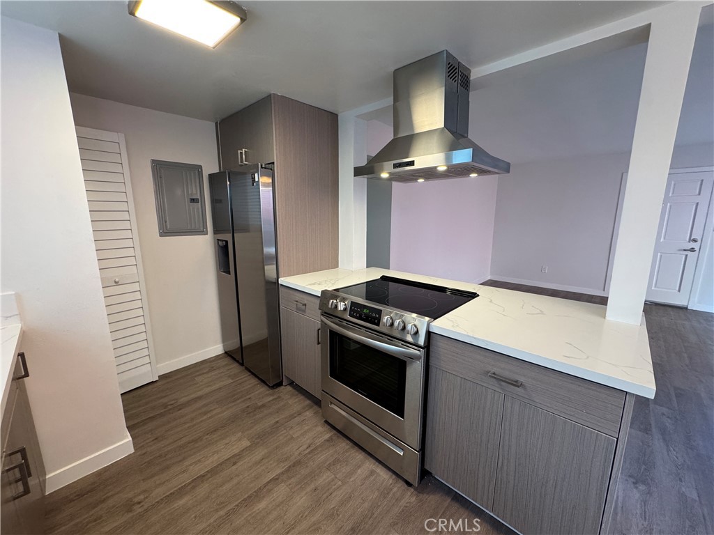 1102 Barbara Street, Unit B Redondo Beach, CA 90277 - Photo 7 of 22 a kitchen with a stove and a refrigerator