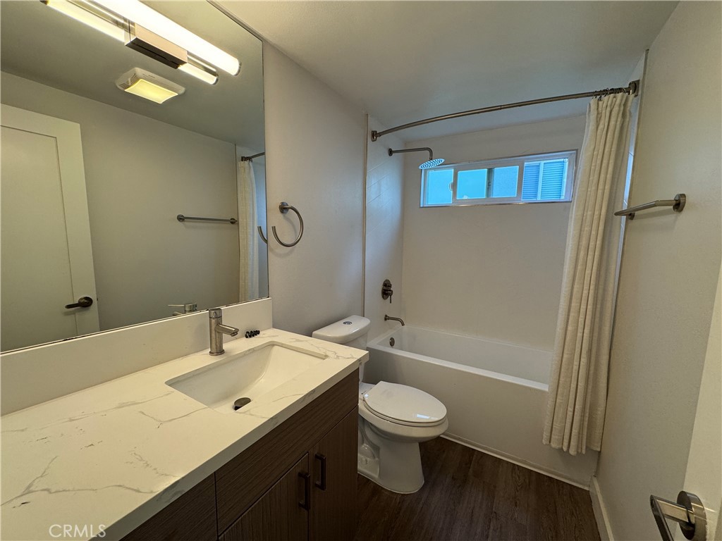 1102 Barbara Street, Unit B Redondo Beach, CA 90277 - Photo 8 of 22 a bathroom with a sink a toilet and shower