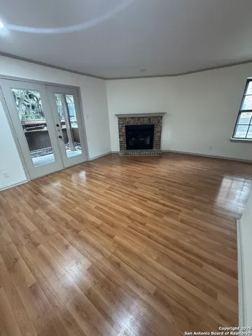 a view of empty room with a fireplace