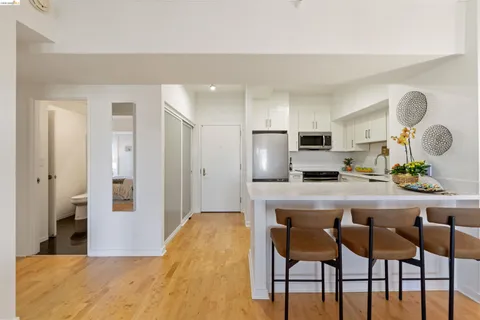a room with furniture and a floor to ceiling window