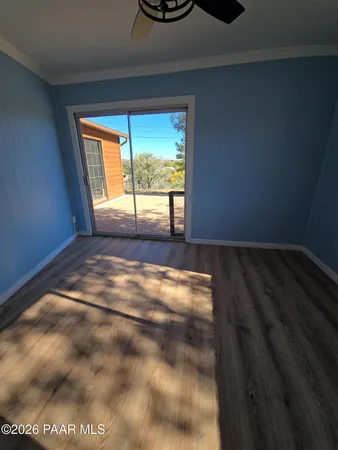 a view of an empty room with a window