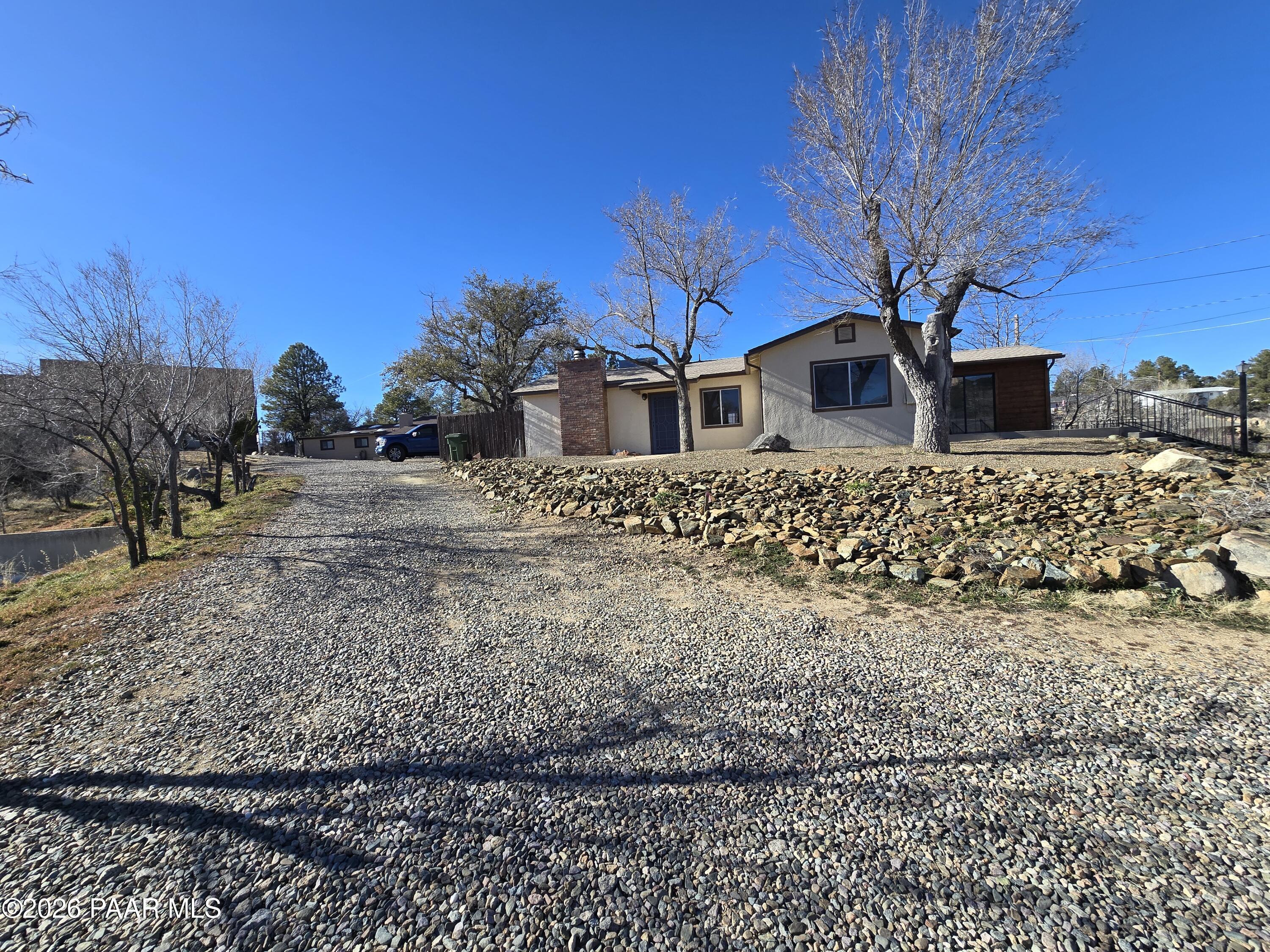410 White Spar Road Prescott, AZ 86303 - Photo 2 of 20 a front view of a house with a yard