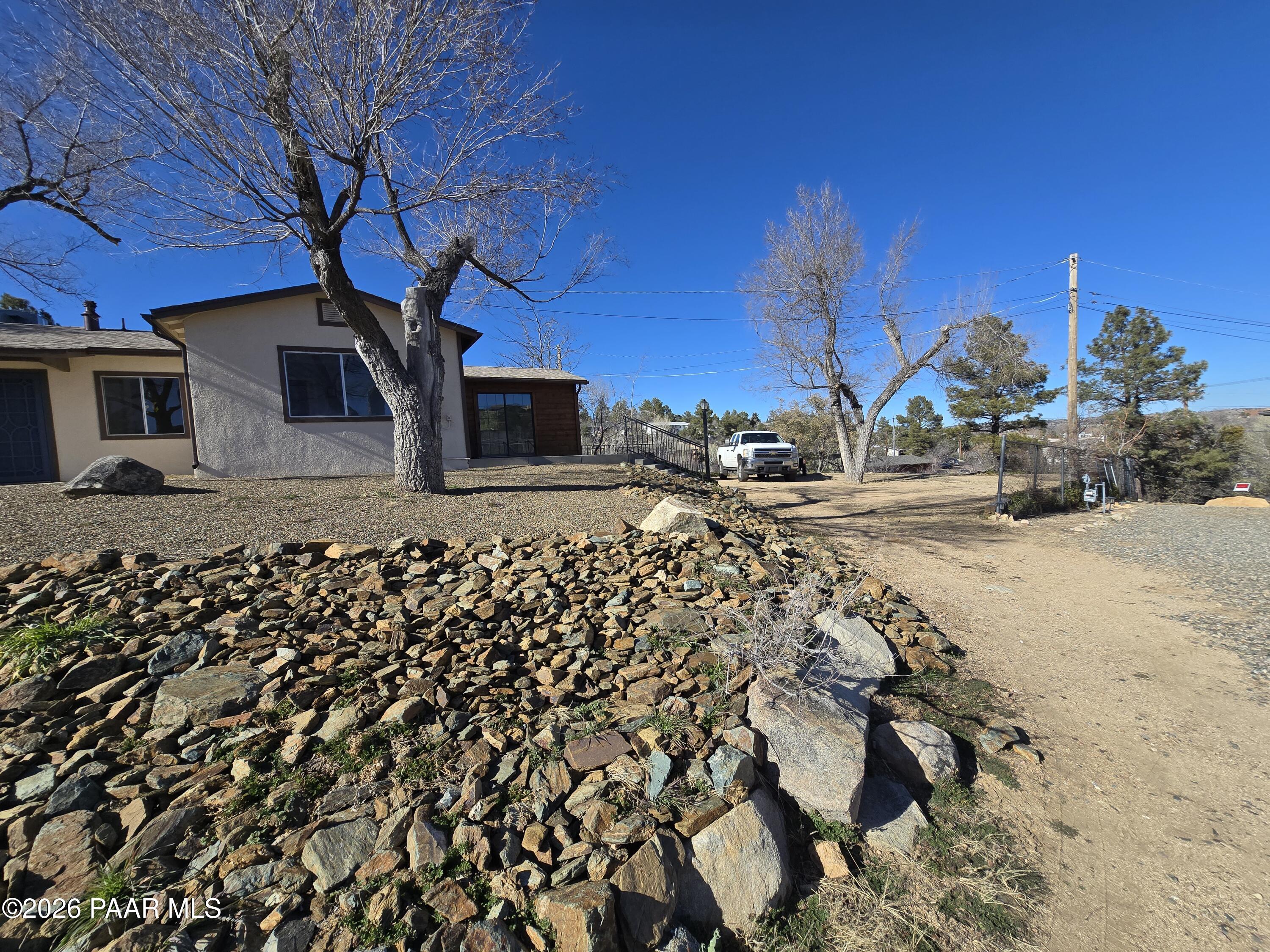 410 White Spar Road Prescott, AZ 86303 - Photo 3 of 20 a front view of a house with a yard