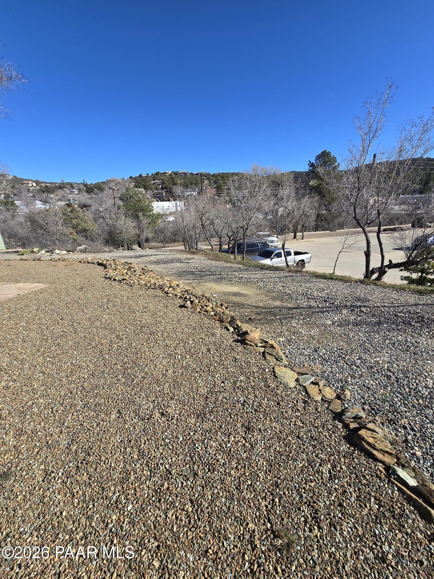 410 White Spar Road Prescott, AZ 86303 - Photo 4 of 20 a view of a dry yard with wooden fence