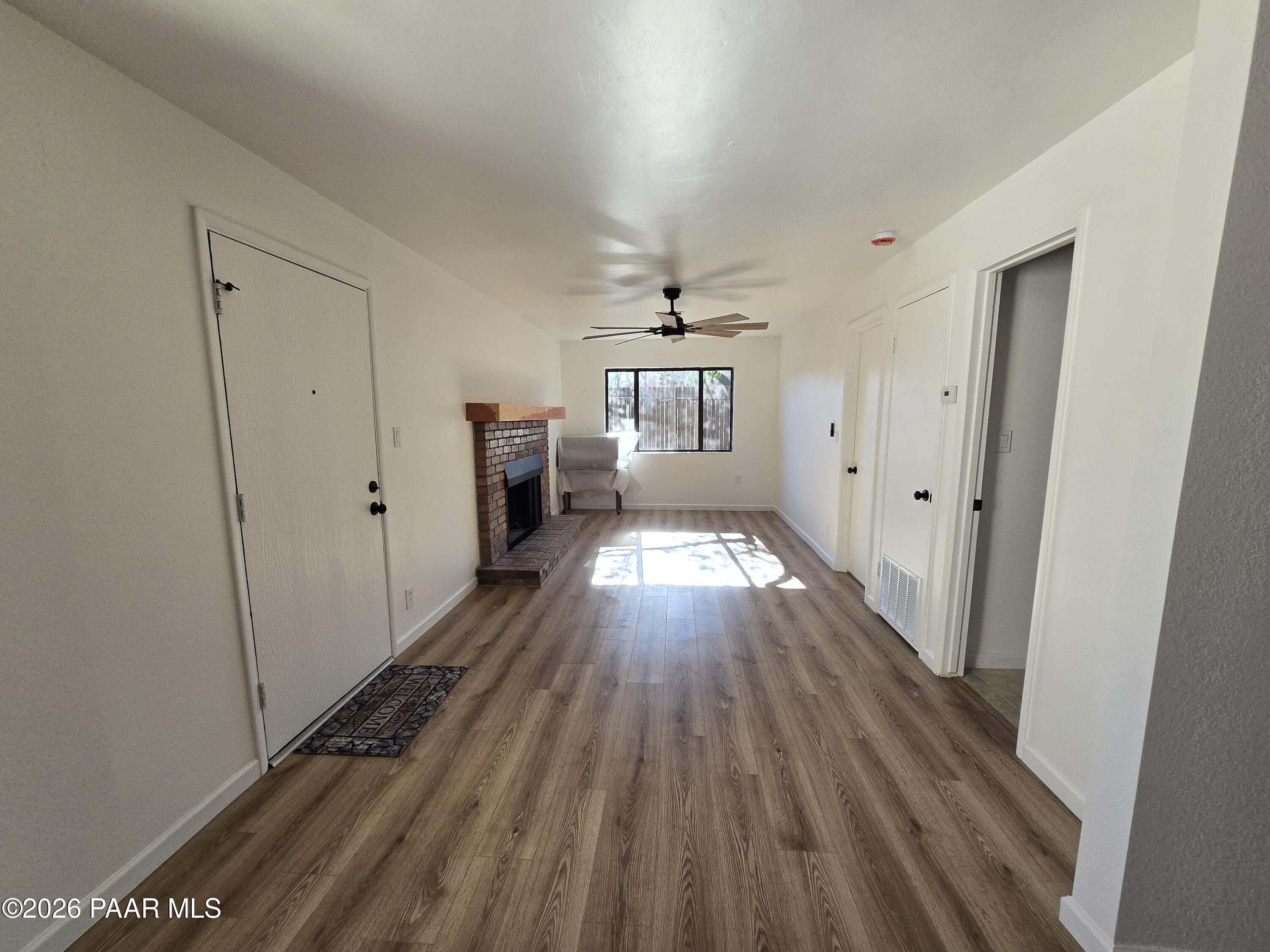 410 White Spar Road Prescott, AZ 86303 - Photo 7 of 20 a view of a hallway with wooden floor and staircase