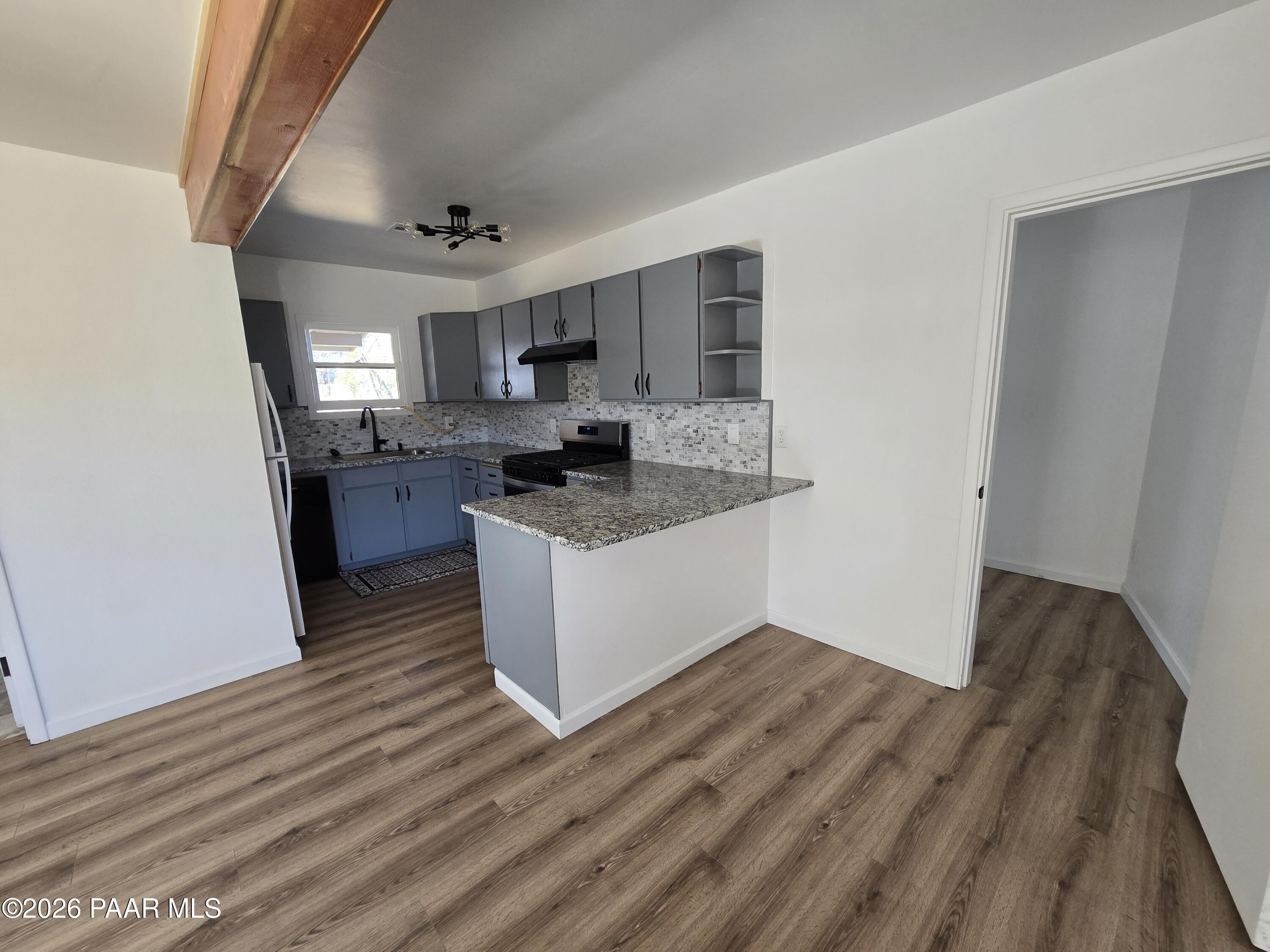 410 White Spar Road Prescott, AZ 86303 - Photo 9 of 20 a kitchen with stainless steel appliances granite countertop a sink stove and refrigerator