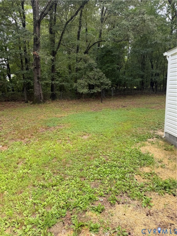 8207 Sebera Road Prince George, VA 23875 - Photo 27 of 27 Spacious rear yard with mature hardwood trees and