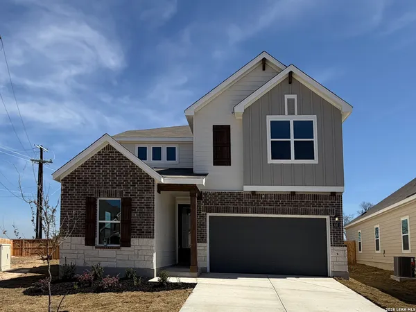 a front view of a house with yard