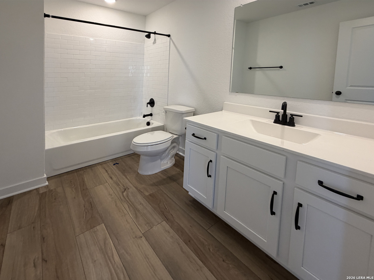 410 Nottabi Road Adkins, TX 78101 - Photo 22 of 33 a bathroom with a sink a toilet a shower and a mirror