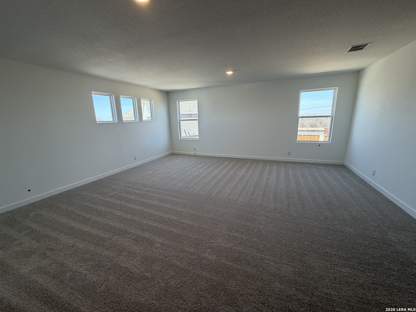 410 Nottabi Road Adkins, TX 78101 - Photo 25 of 33 an empty room with windows