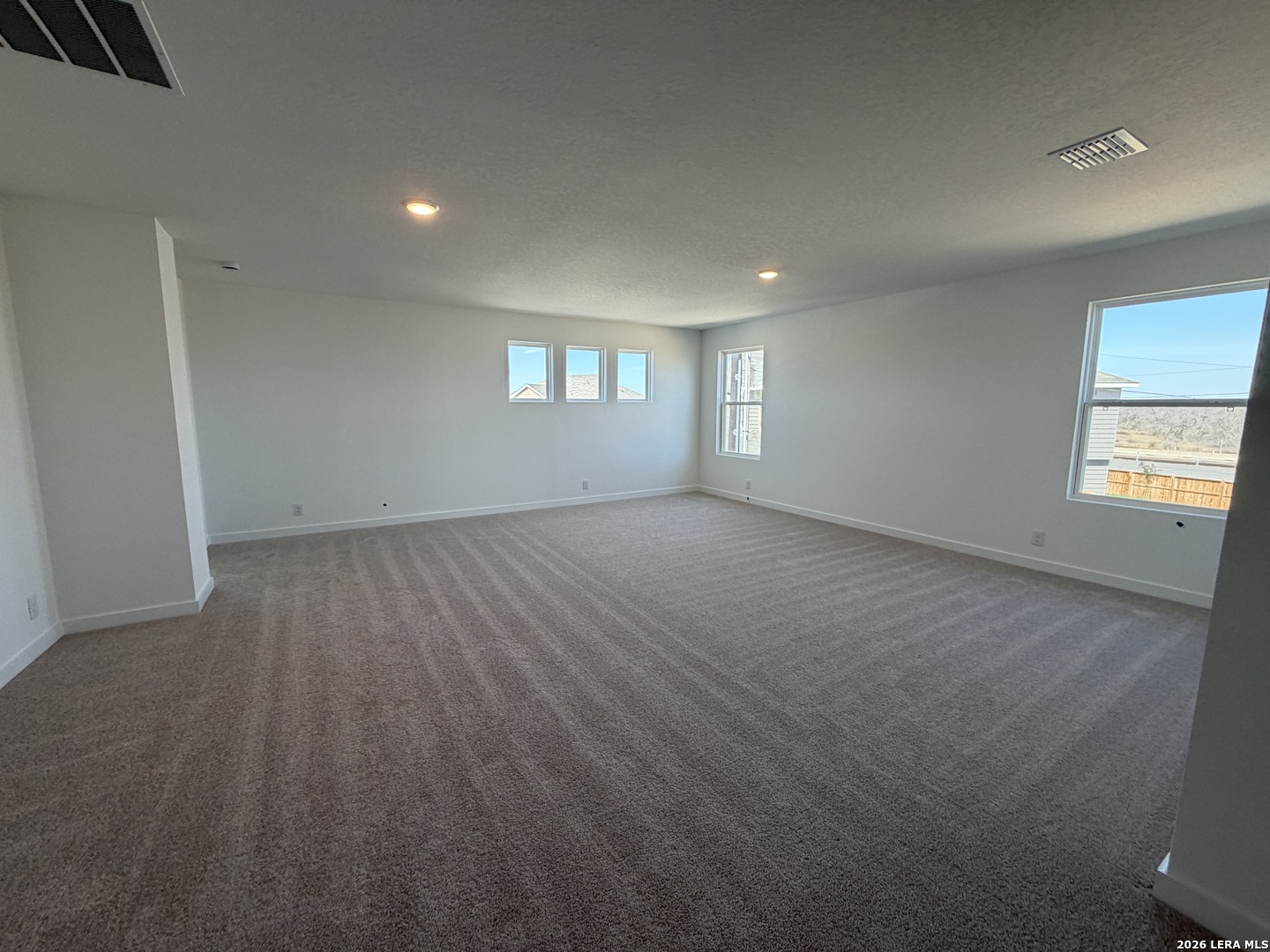410 Nottabi Road Adkins, TX 78101 - Photo 26 of 33 an empty room with windows and entrance