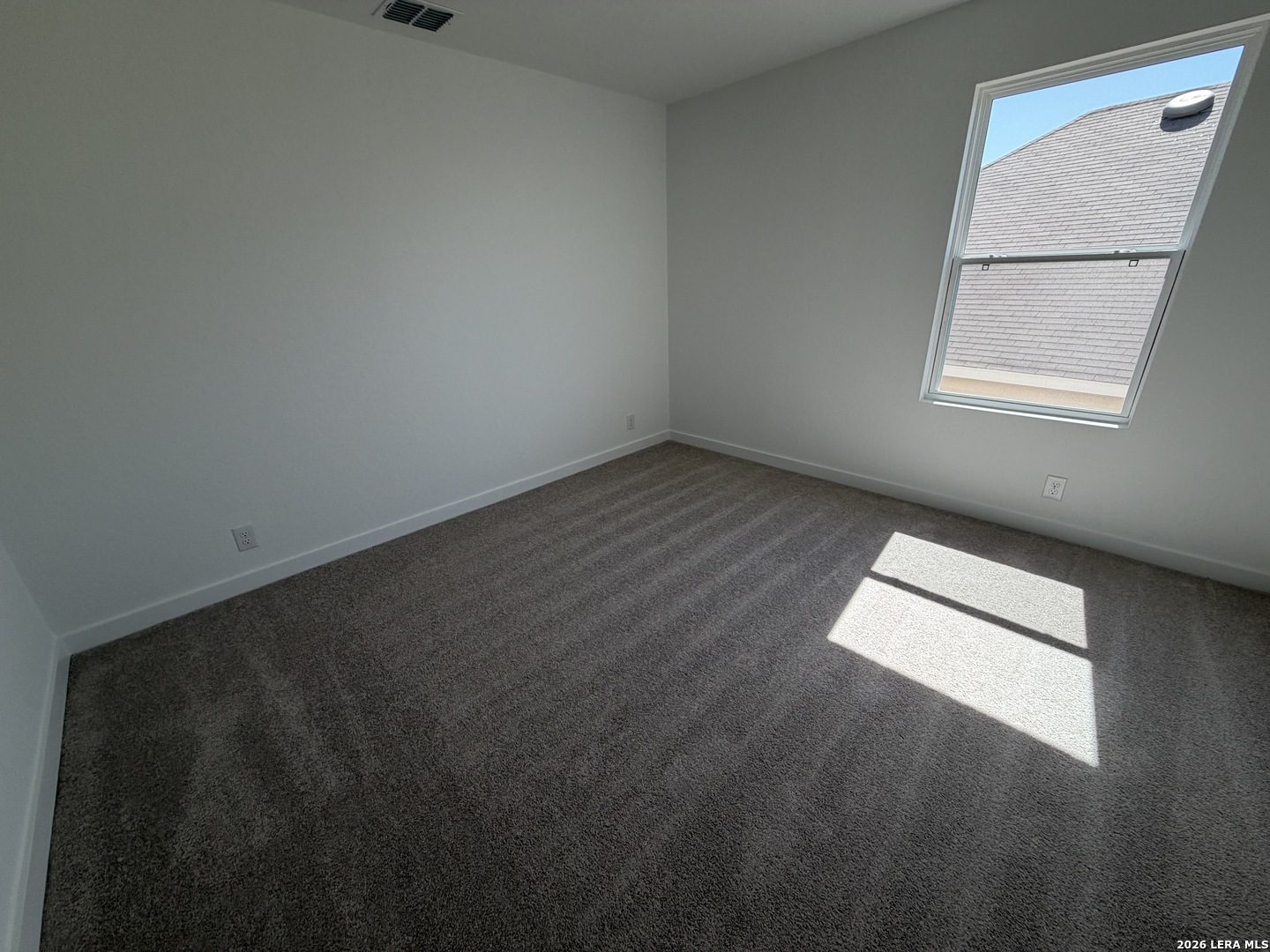 410 Nottabi Road Adkins, TX 78101 - Photo 27 of 33 an empty room with a window