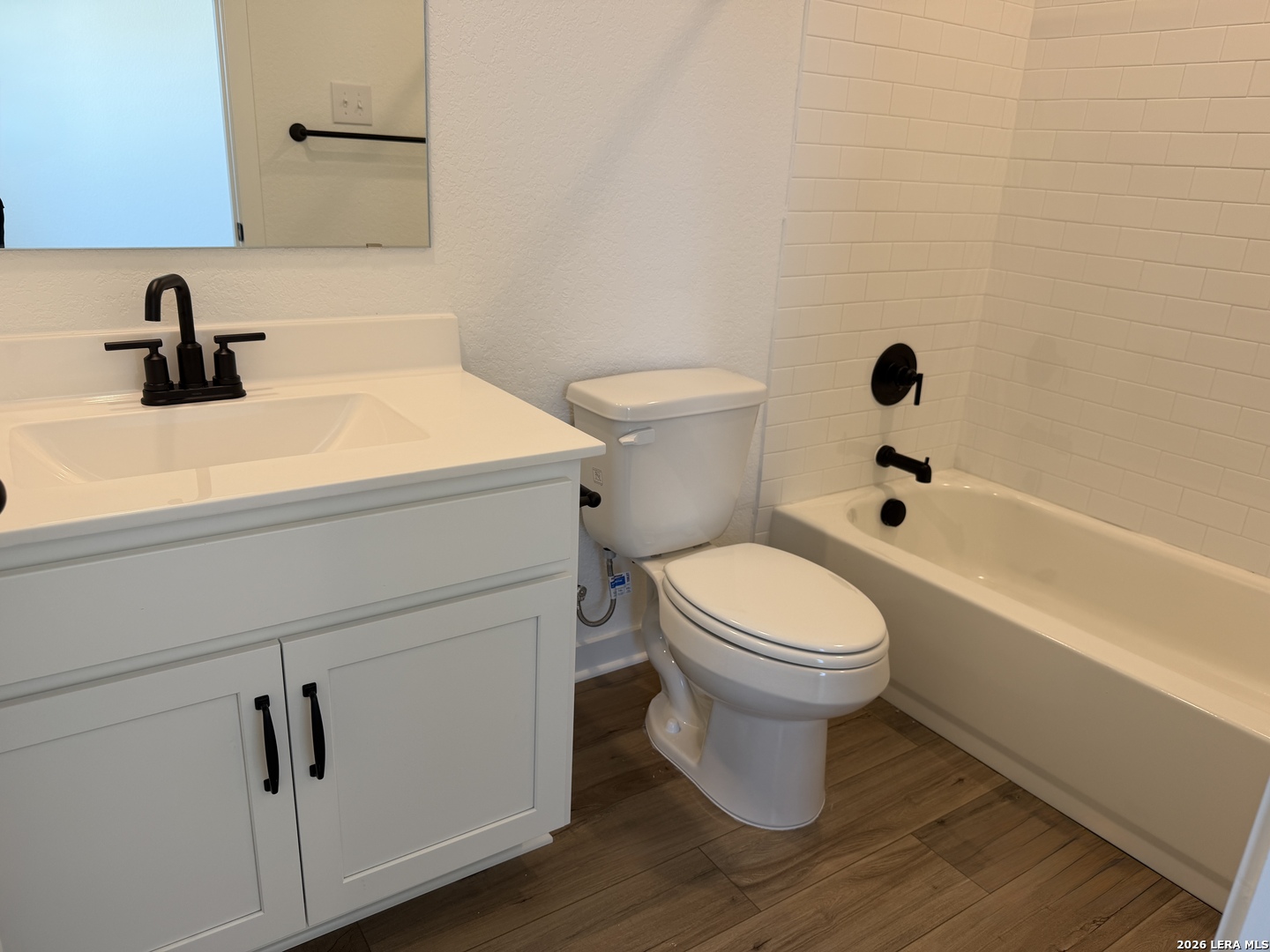 410 Nottabi Road Adkins, TX 78101 - Photo 28 of 33 a bathroom with a sink a toilet and shower