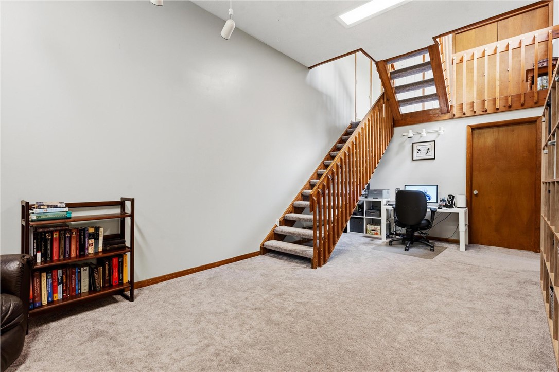 1940 Armstrong Road Fairborn, OH 45324 - Photo 14 of 48 This versatile area features a staircase, inviting natural light, and ample space for various activities.