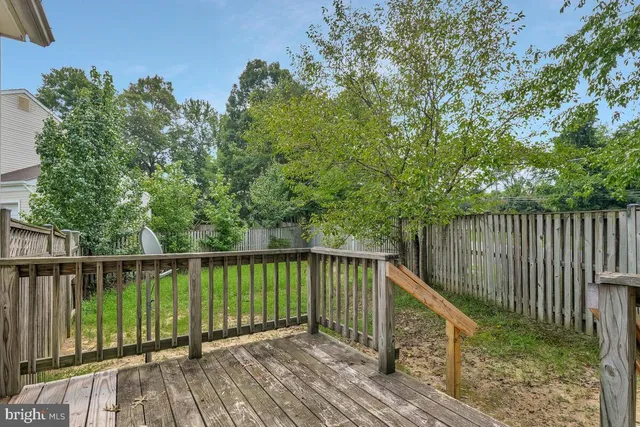 a view of balcony with wooden floor