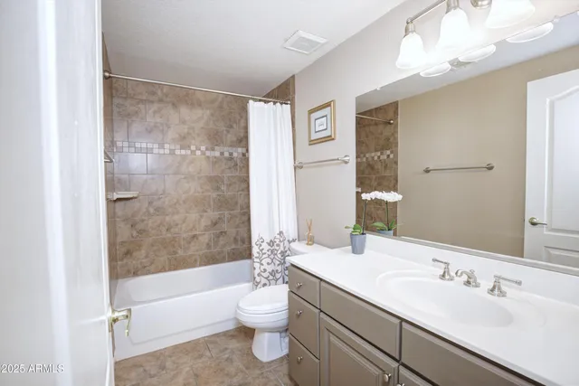 a bedroom with furniture and a large window