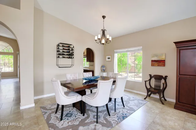 a kitchen with kitchen island granite countertop a sink stove and refrigerator