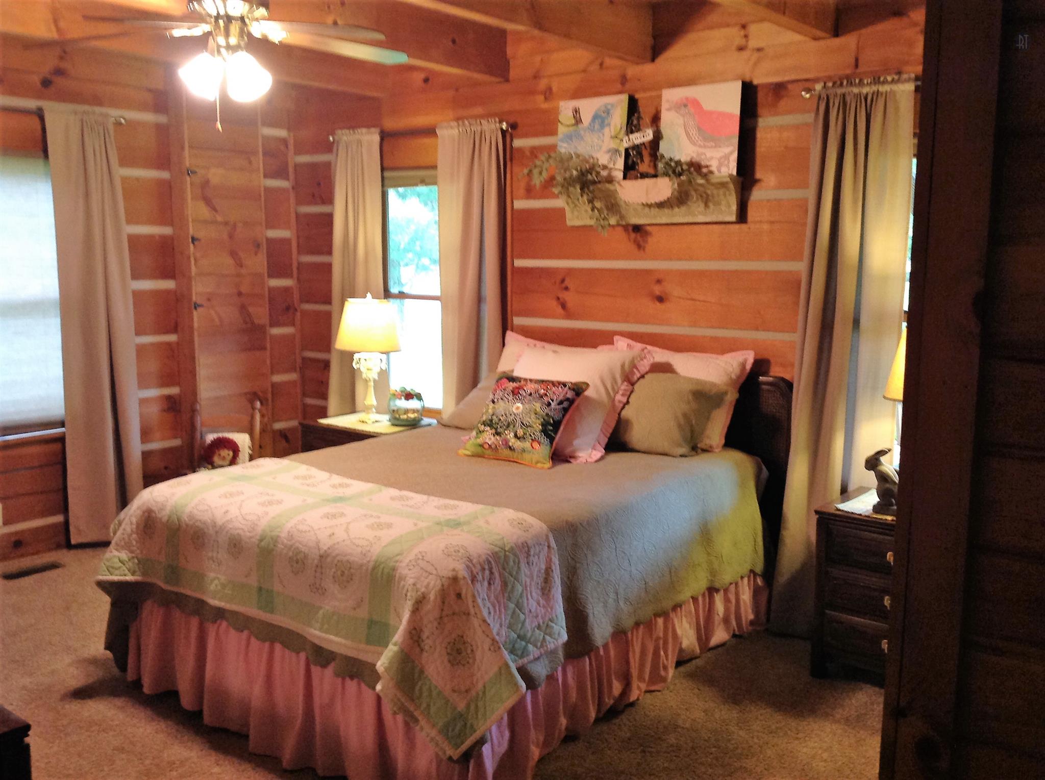 1099 Pinhook Road Lebanon, TN 37090 - Photo 16 of 26 a bedroom with a bed and a mirror