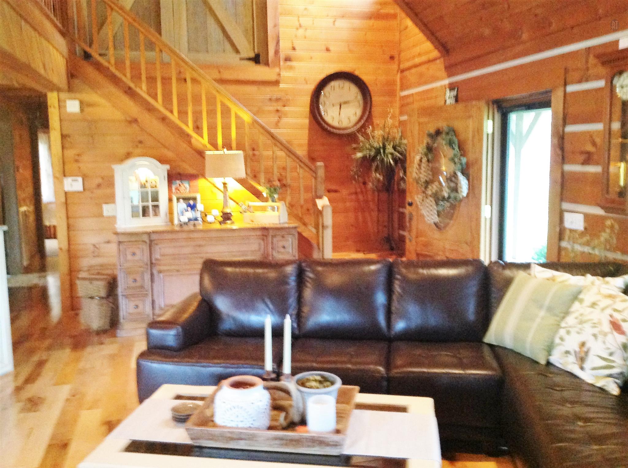 1099 Pinhook Road Lebanon, TN 37090 - Photo 22 of 26 a living room with couches and a large window with garden view