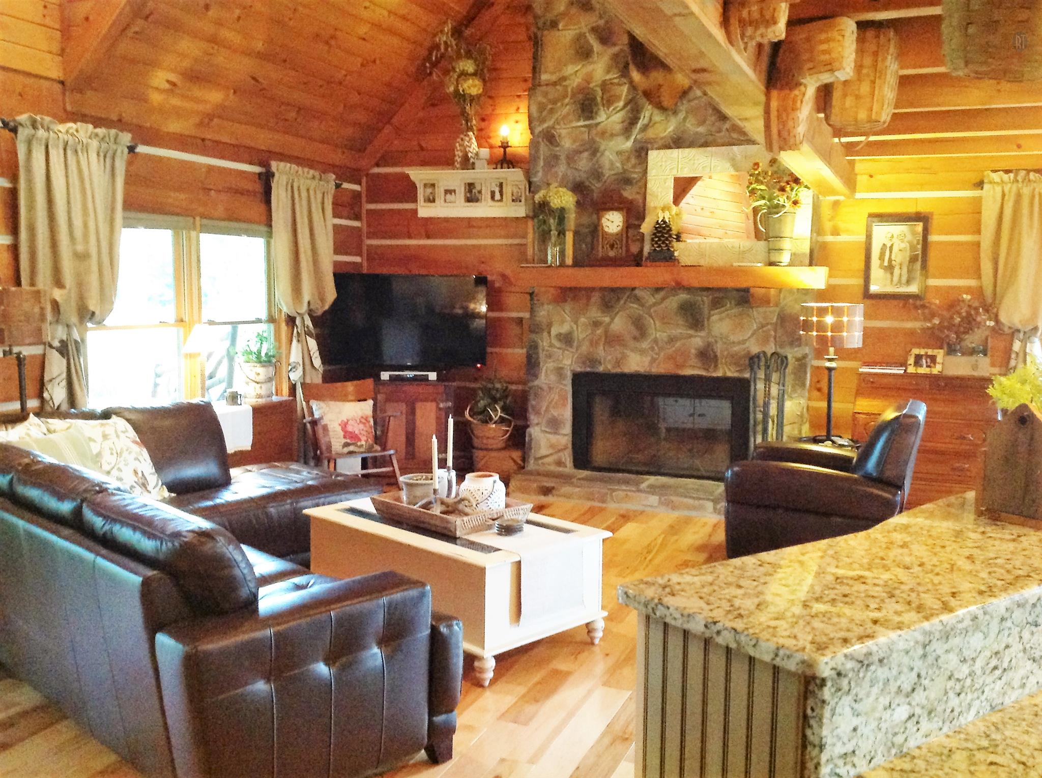 1099 Pinhook Road Lebanon, TN 37090 - Photo 23 of 26 a living room with furniture a fireplace and a flat screen tv