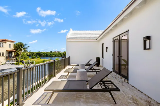 a bedroom with a large bed and a large window