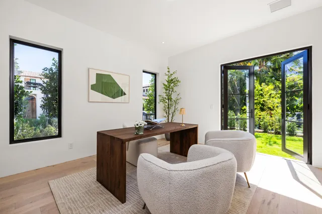 a bathroom with a double vanity sink mirror and toilet