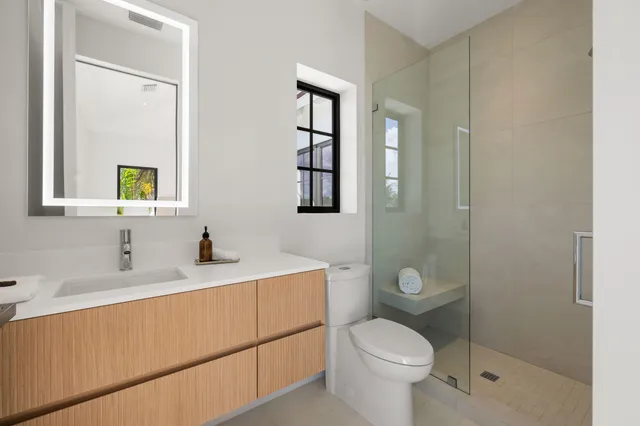 a dining room with furniture and a floor to ceiling window