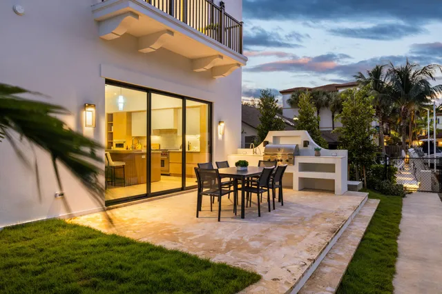 an aerial view of a house with a lake view