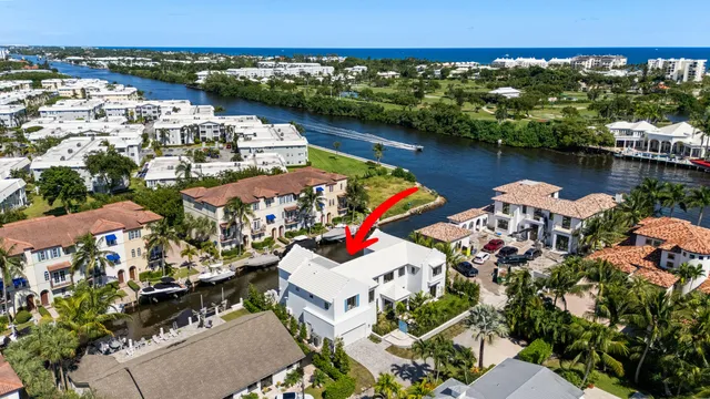 an aerial view of a house with a lake view