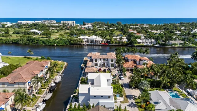 an aerial view of a houses with a lake view