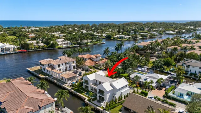 an aerial view of residential houses with city view