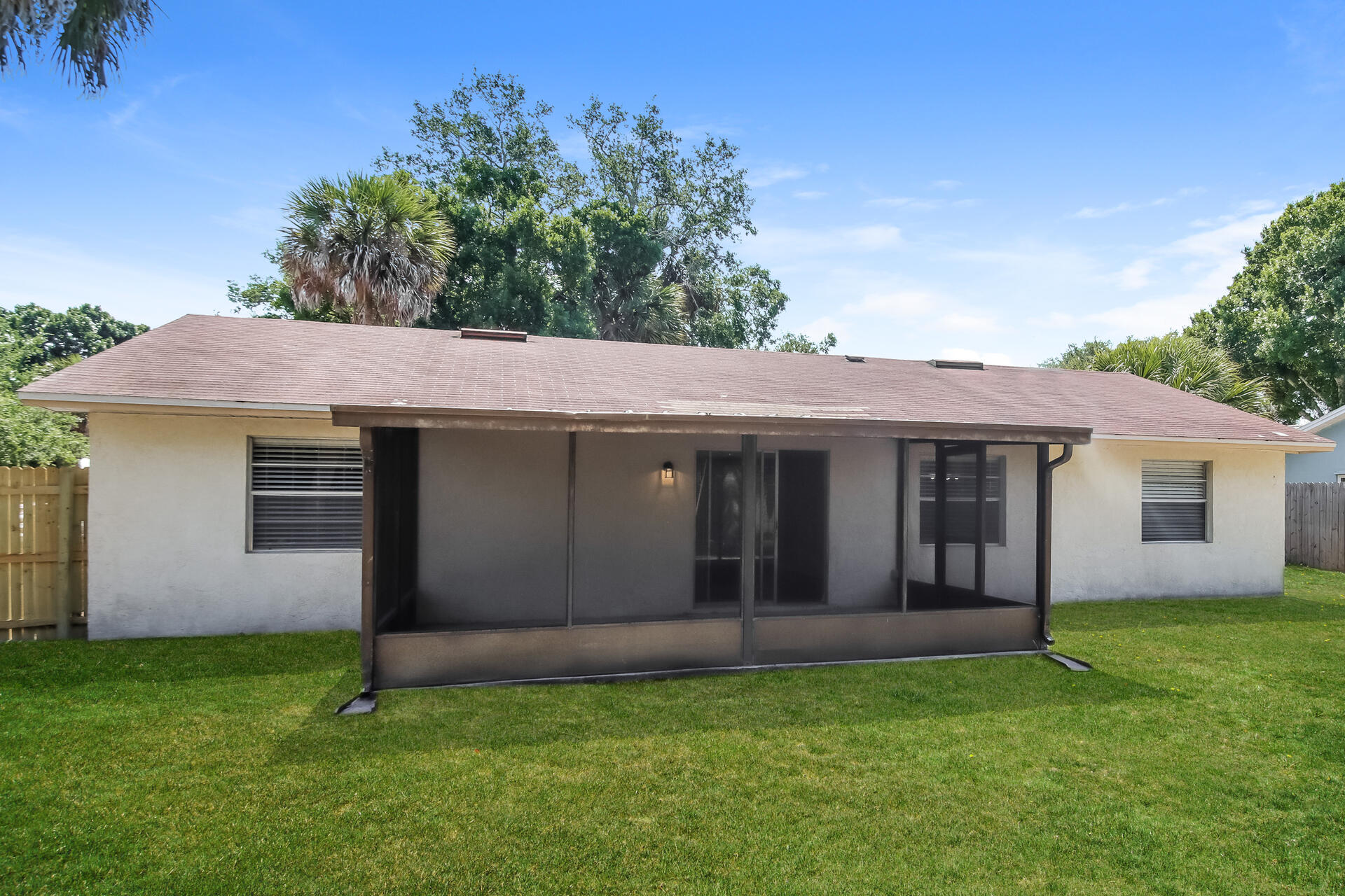 3386 Jay Tee Drive Melbourne, FL 32901 - Photo 14 of 16 a view of a house with a yard