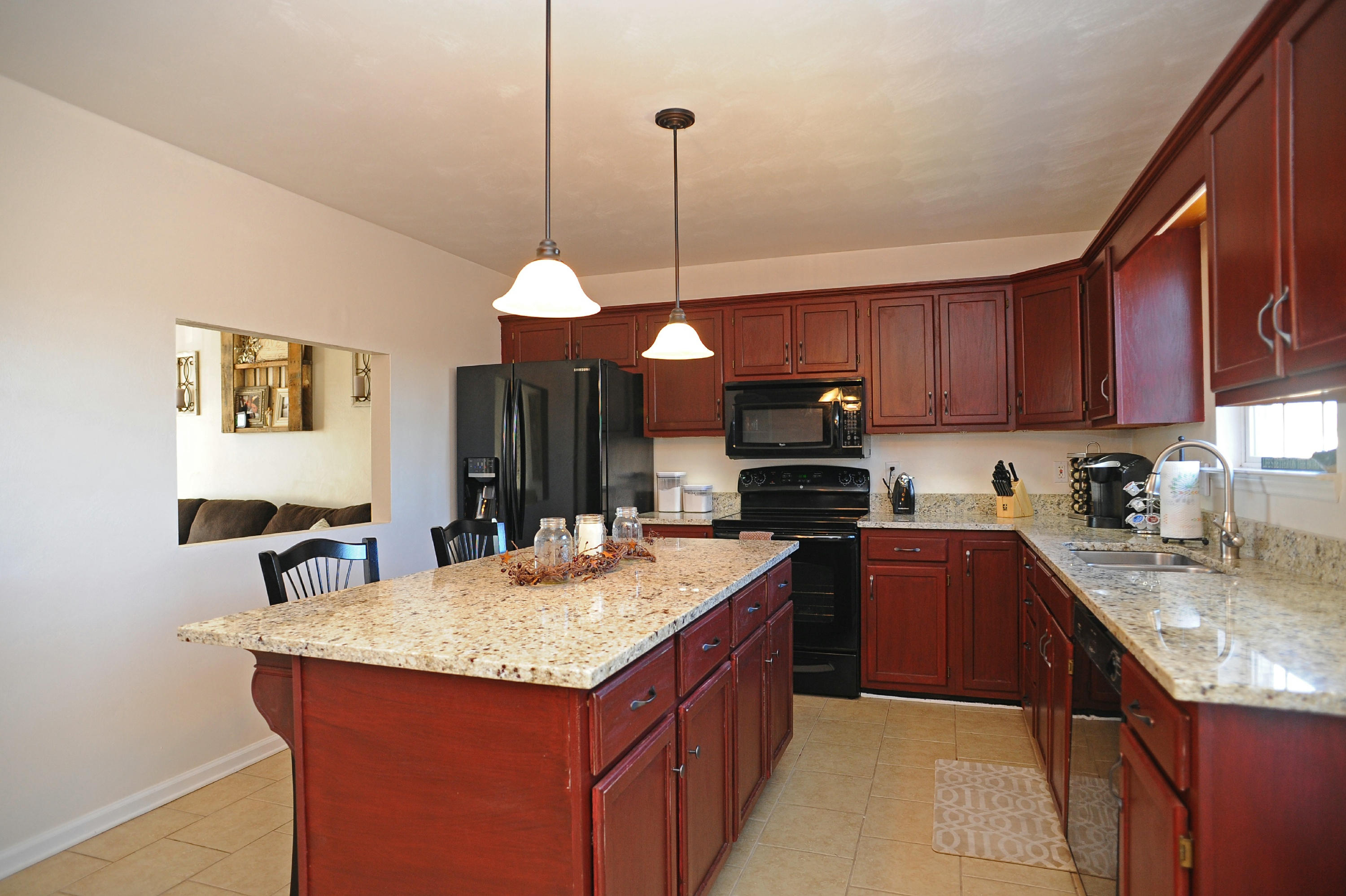 265 Northridge Road Hardy, VA 24101 - Photo 3 of 59 a kitchen with a refrigerator a sink and wooden cabinets